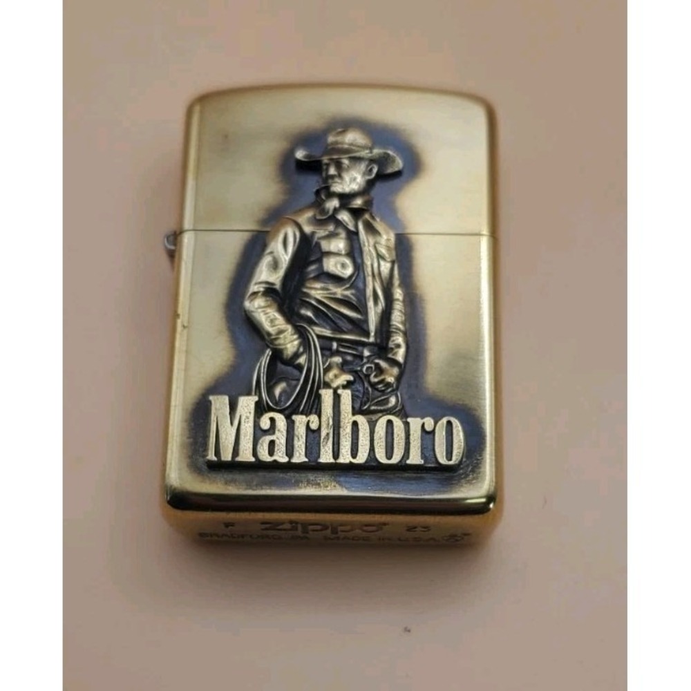 Zippo Lighter With A Cowboy With Rope Medallion Brass Case Armor Unused